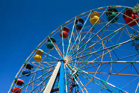 Ferris wheel against the blue skyの写真素材
