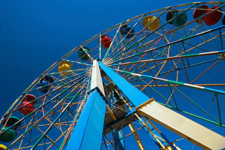 Ferris wheel against the blue skyの写真素材