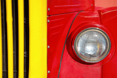 Old car red and yellow, front, close-up