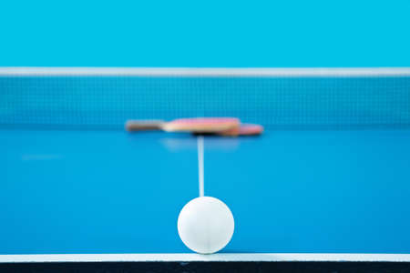 The ball for table tennis lies on tennis table, close-upの写真素材