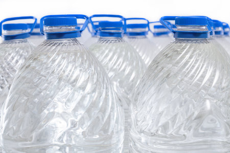 Water in plastic bottles on a white background, isolatedの写真素材