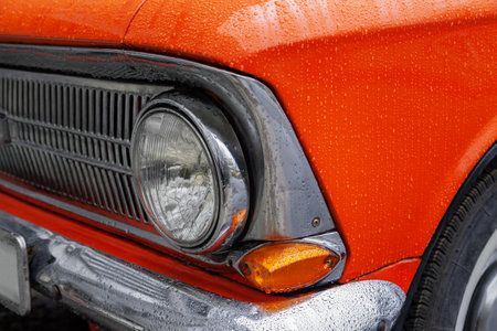 Front of orange retro car, close-upの写真素材