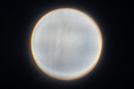 The circle of light on a black background coming from the overhead projector