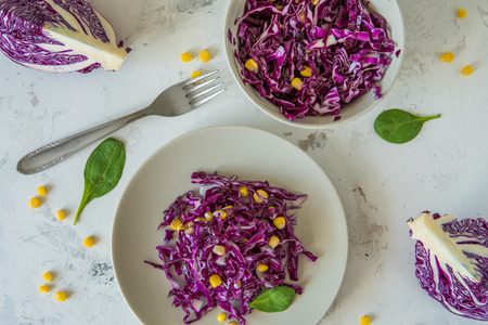 Fresh red cabbage salad with corn. Vegeterian and diet food, top view.の写真素材