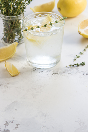 Detox water with lemon and thyme in glass, copy space .の写真素材