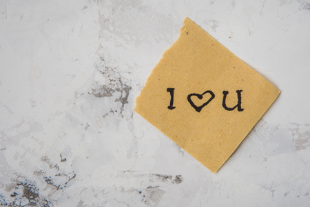 Note with text i love you on a white background.の写真素材