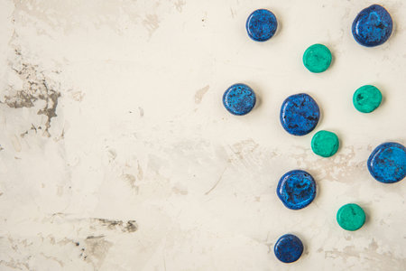 Decorative blue stones on a light background, copy space.