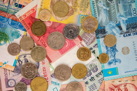 Money from multiple countries. Banknotes and coins top view.の写真素材