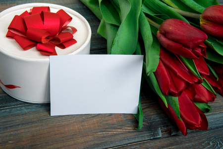 Red tulips and empty card for your text.の写真素材