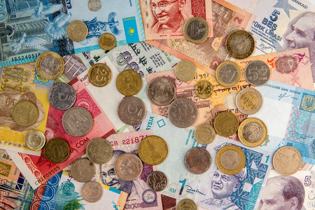Money from multiple countries. Banknotes and coins top view.の写真素材