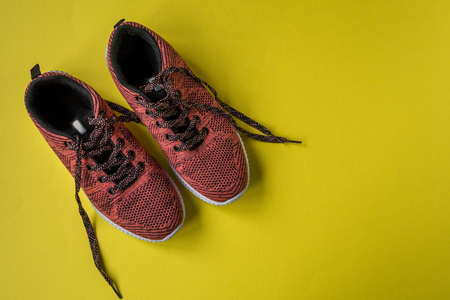 Sneakers on a yellow background top view copy space.の写真素材