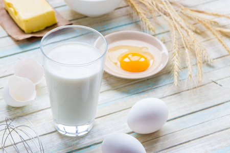 Ingredients for baking: milk, flour, egg and butter.の写真素材