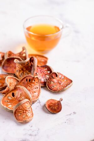 Matum tea. Bael fruit tea and slices of dried bael fruitの写真素材