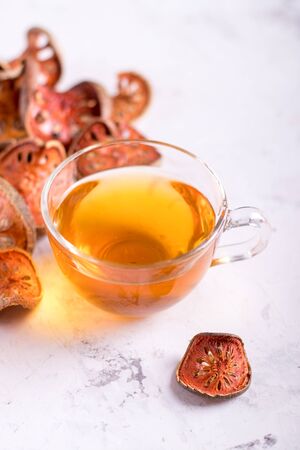 Matum tea. Bael fruit tea and slices of dried bael fruitの写真素材
