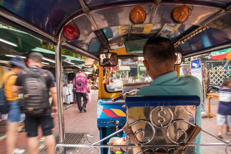 Bangkok, Thailand - April, 2019: Tuk-Tuk moves on the Khaosan road in Bangkok, local taxiのeditorial素材