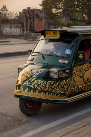 Ayutthaya, Thailand - April, 2019: tuk-tuk on the street in Ayutthaya, Thailand