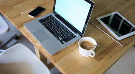 laptop,pad,notebook,mobile phone and notebook on table