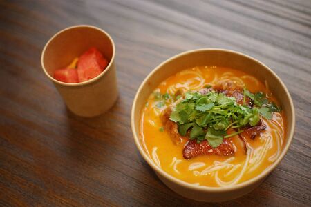 chinese food noodles with roasted duck and fruitの写真素材