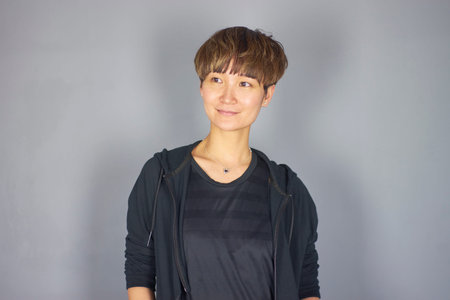 portrait of Chinese woman in leisure wear in studio