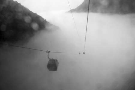 ropeway in mountains and mist ink painting styleの写真素材