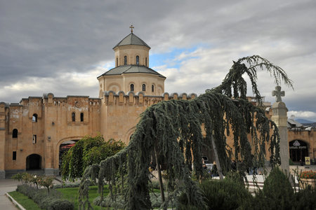 Touristic landmark in Tbilisi Georgia. Panorama of fortress citadel Narikala with St Nikolas church