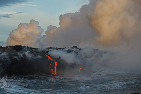Hawaii. Volcano eruption. Hot lava flows into the waters of the Pacific Ocean.