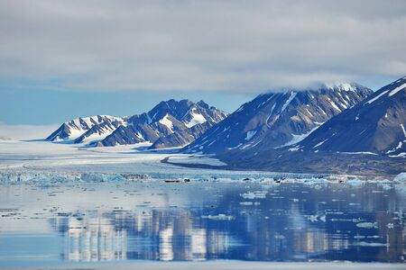 Greenland. Mountains covered with snowの写真素材