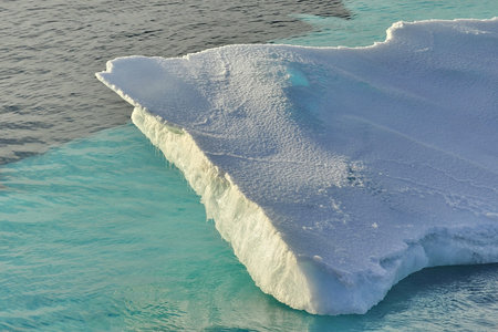 Global warming. Icebergs and mountains in the ocean.