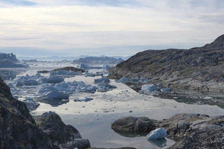 Greenland. Iceberg and ice from glacier in arctic nature. Icebergs in Ilulissat icefjord. Affected...
