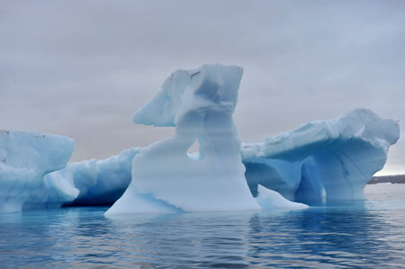 Greenland. Icebergs. Giant floating Iceberg from melting glacier. Global Warming and Climate Change.