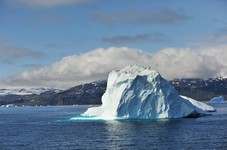 Greenland. Icebergs in the ocean. The nature of the North.