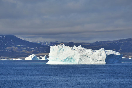 Greenland. Icebergs in the ocean. The nature of the North.