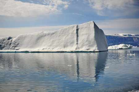 Greenland. Icebergs in the ocean. The nature of the North.