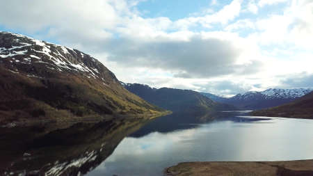 Lofoten Islands. Norway. Aerial footage of small fishing village. Popular tourist destination with its typical red houses and natural beauty.の写真素材