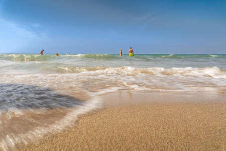Idyllic travel beach view from a lower perspective with a wave.