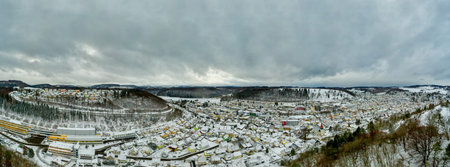 Albstadt, snow city at the Schwaebische Alb of germany in white powdered winter landscape, droneshot...