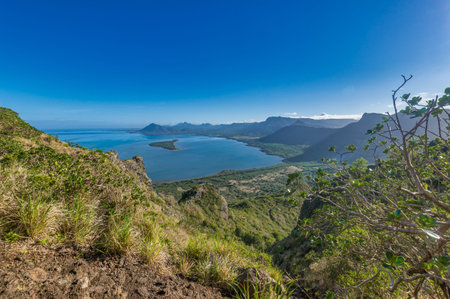 Travel Destination - Beautiful natural view at an island and mountains in background at Mauritius.