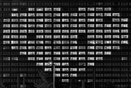 Heart shape illuminated windows of a building as a gesture for people who support others like now in...