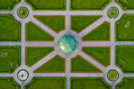 Symmetrial aerial view at a green park with a temple in its center, straight top down from above, popular architecture photo.の写真素材