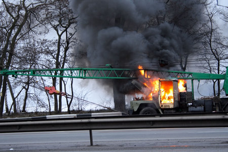mobile lifting crane truck in fire on the road