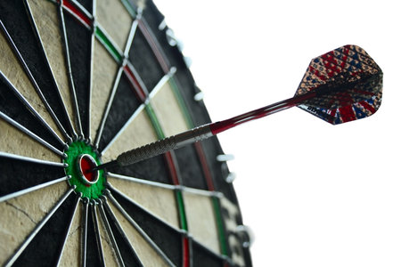 proffesional dart hitting center target board as concept success isolated on white