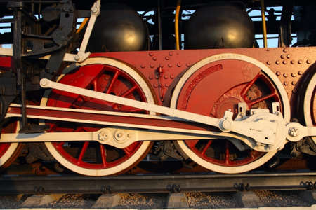 pair red wheel of old steam train with connecting rodの写真素材