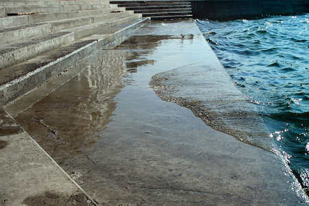 parapet with stairs and sea waves in Sevastopol cityの写真素材