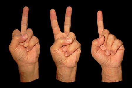 three man hands show middle finger, victory and direction isolated on blackの写真素材