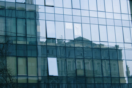 reflecting in business center mirror windows another building with one of the numerous window another angle, Ukrainian capital - Kyivの写真素材