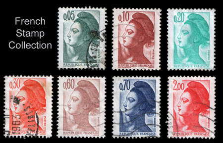 french stamp collection isolated on blackの写真素材