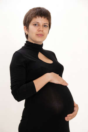 Beautiful pregnant woman in black dressの写真素材