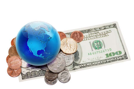 World currency. Globe view to North America on dollar coins and banknote. Focus on globe.の写真素材