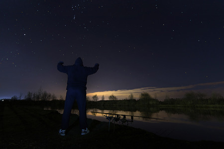 Fisherman in Starry Night, Looking to Orion the Hunter Constellation , patience.の写真素材