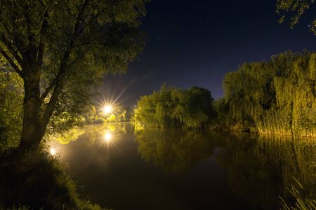 Beautiful Night Reflection on lake, Nightfishingの写真素材